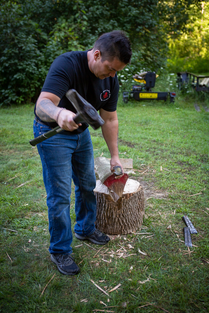 Jack Johnson cutting wood for lacrosse sticks.
